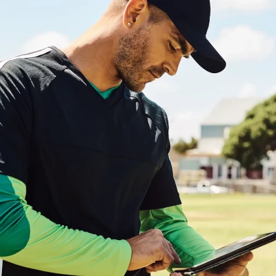 Coach looking at a tablet