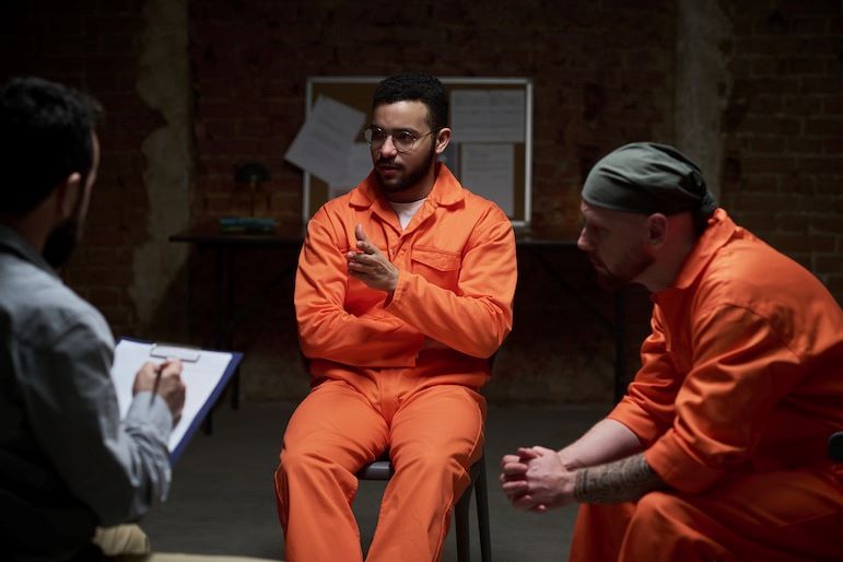 inmates speaking with interrogator