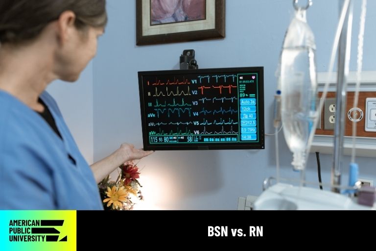 bsn-vs-rn registered nurse looking at patient's vitals