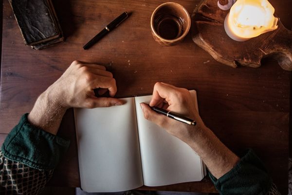 Creative writing student with notebook