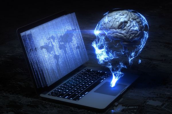 counterintelligence depicted by holographic figure looking at laptop