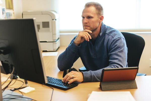 athletic director looking at computer