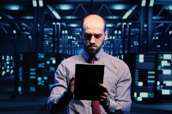 security management professional looking at tablet