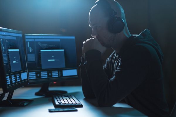 intelligence professional reviewing data on computer