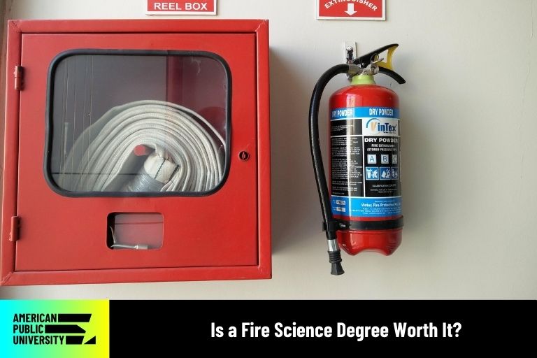 is-a-fire-science-degree-worth-it fire hose and extinguisher on wall