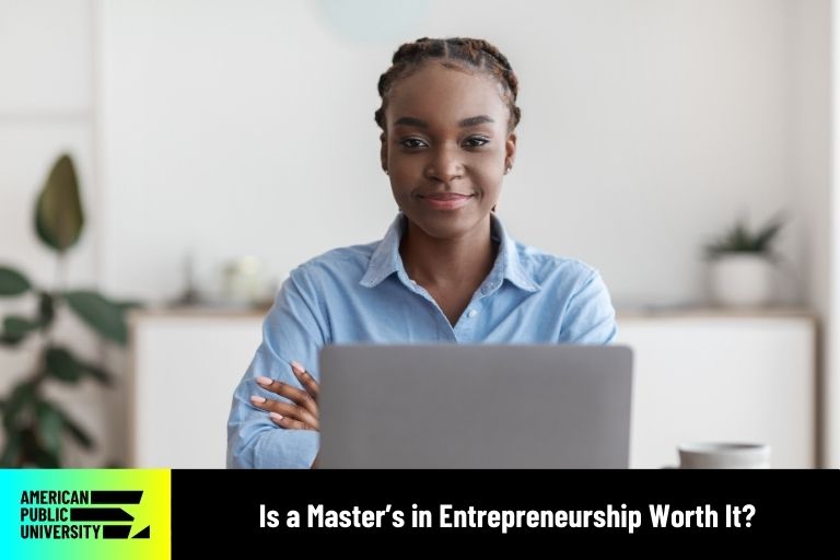 entrepreneurship student with laptop and coffee mug