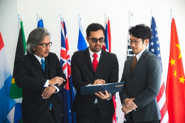 international relations professionals discussing document