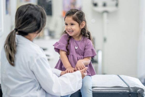 public health degree graduate working with child