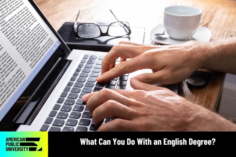 English degree student typing on laptop