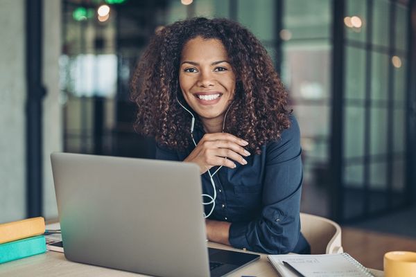 BA in Management student on laptop