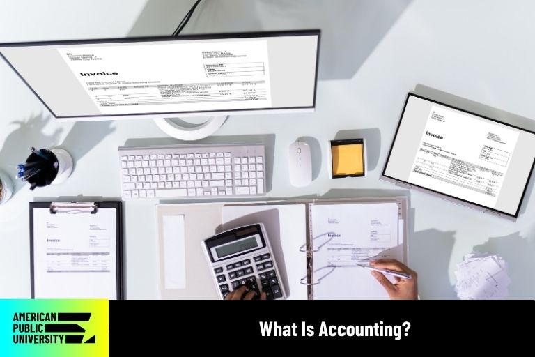 what-is-accounting accountant working on computer and calculator