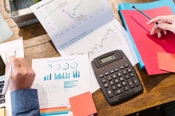 entrepreneurship degree student using calculator
