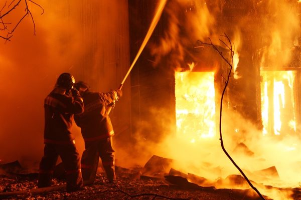 fire science graduates fighting house fire