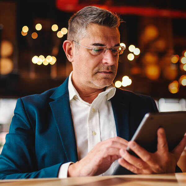 man looking at tablet