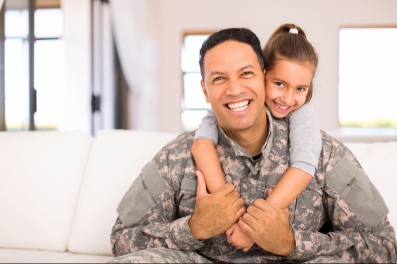 Military Man Standing Beside Military Truck