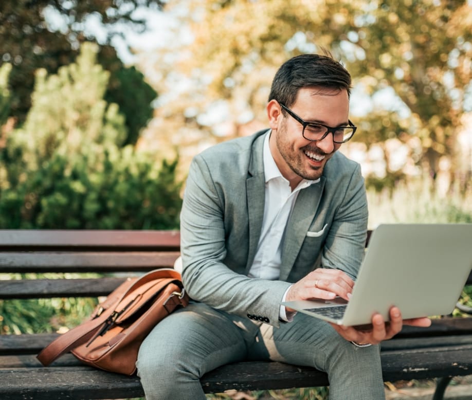 man in suit on computer