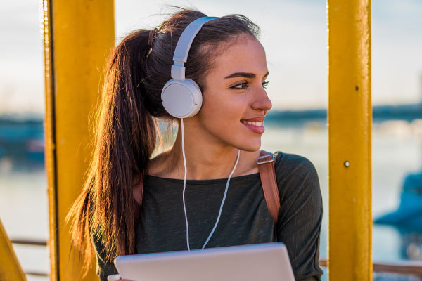 Student with Headphones Smiling